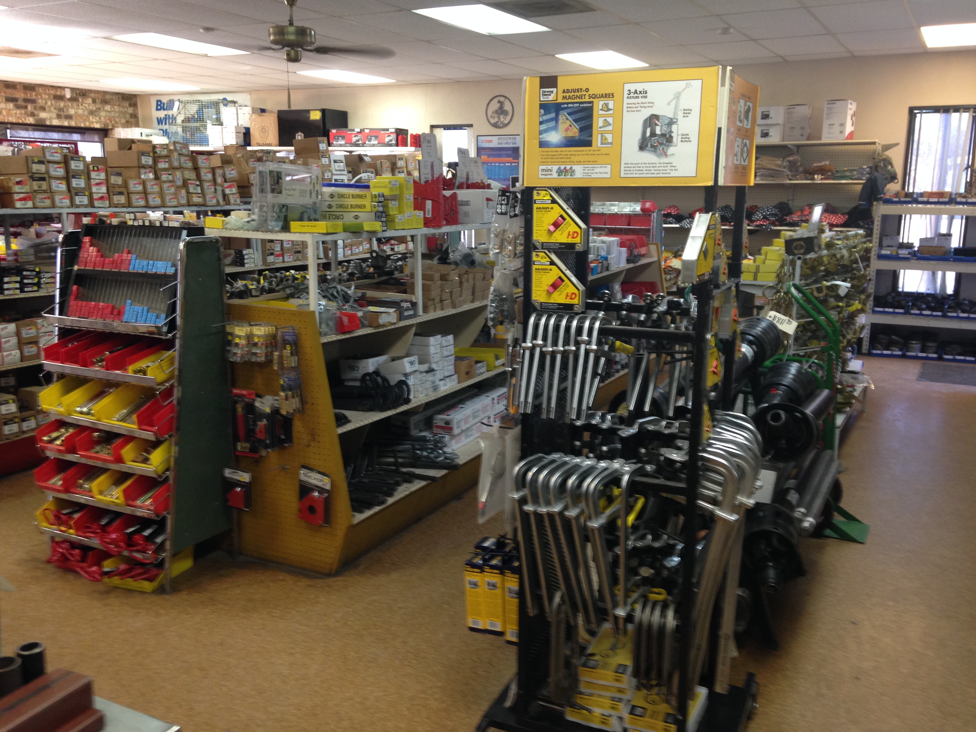Interior of Riggs Machine & Welding supply store showing welding accessories and trailer hardware in Stephenville, TX