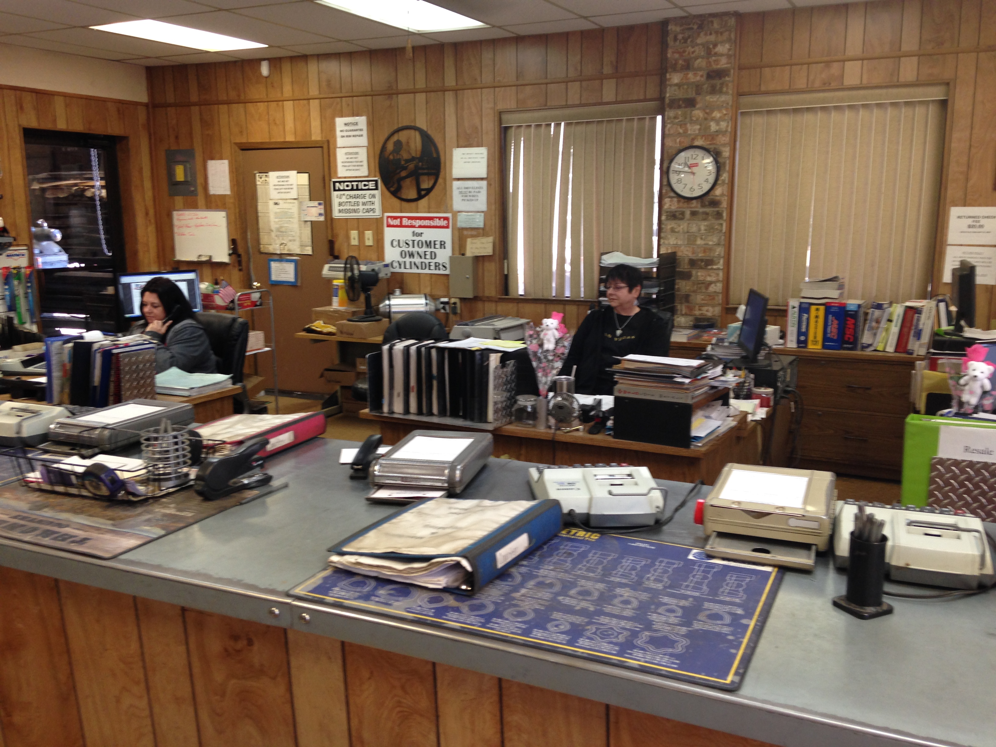 Staff at the front counter of Riggs Machine & Welding in Stephenville, TX, ready to assist walk-in customers with parts, supplies, and service