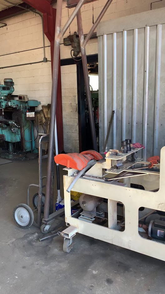 Fabrication equipment and project in progress on the floor of Riggs Machine & Welding's shop in Stephenville, TX