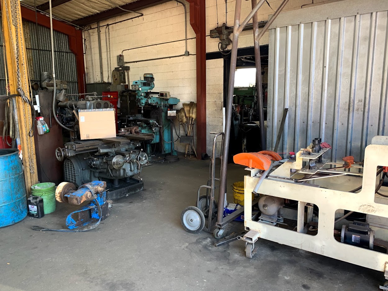 Wide view of Riggs Machine & Welding's machine shop floor showing multiple machining stations
