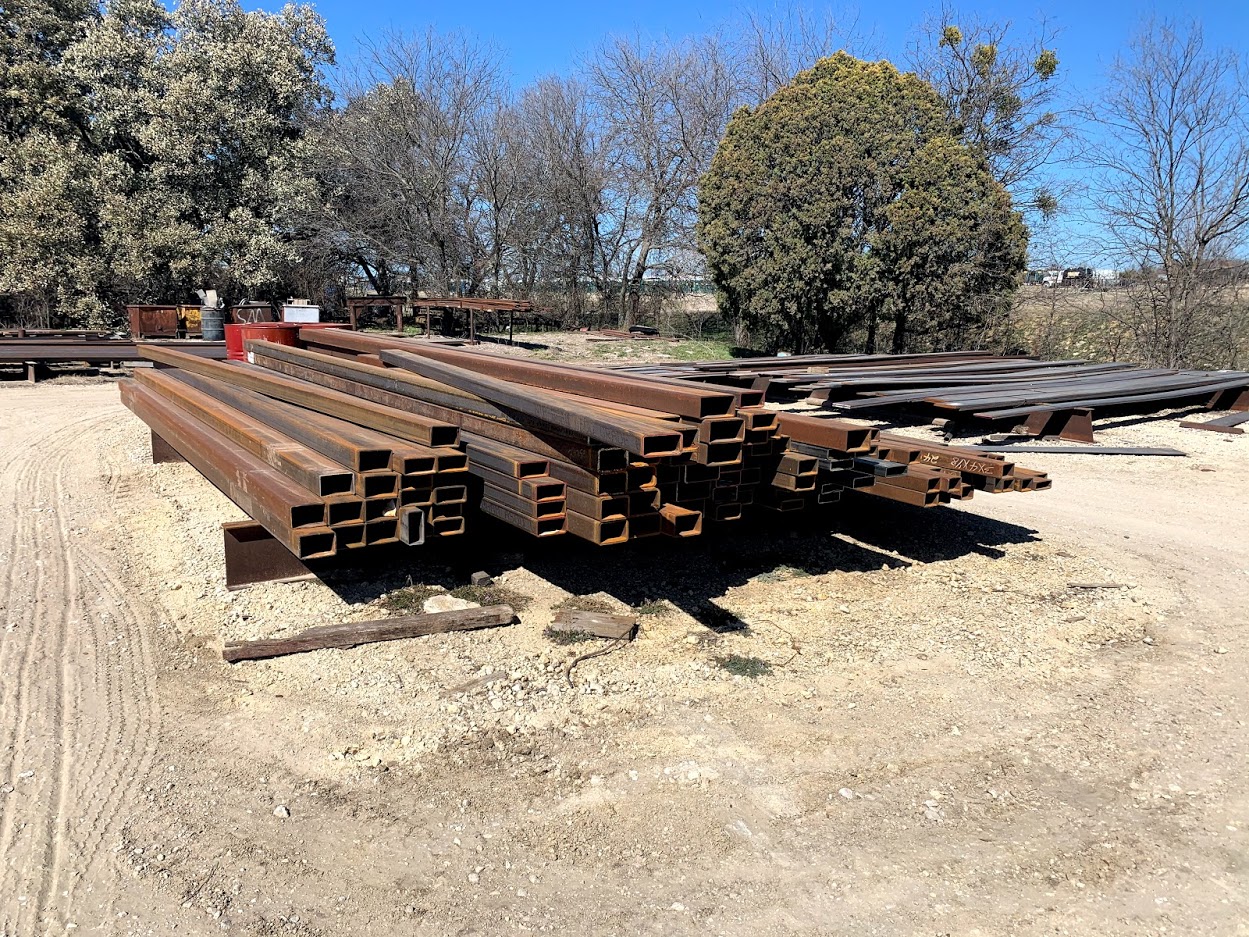 Large quantity of square and rectangular steel tubing in assorted sizes at Riggs Machine & Welding metal yard, Stephenville, TX